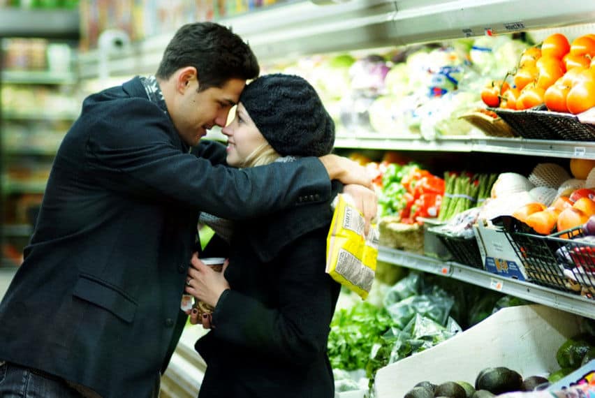 Engagement moments at a grocery store aisle