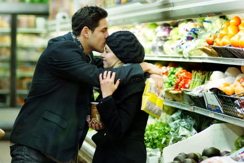 In engagement photos in the Grocery